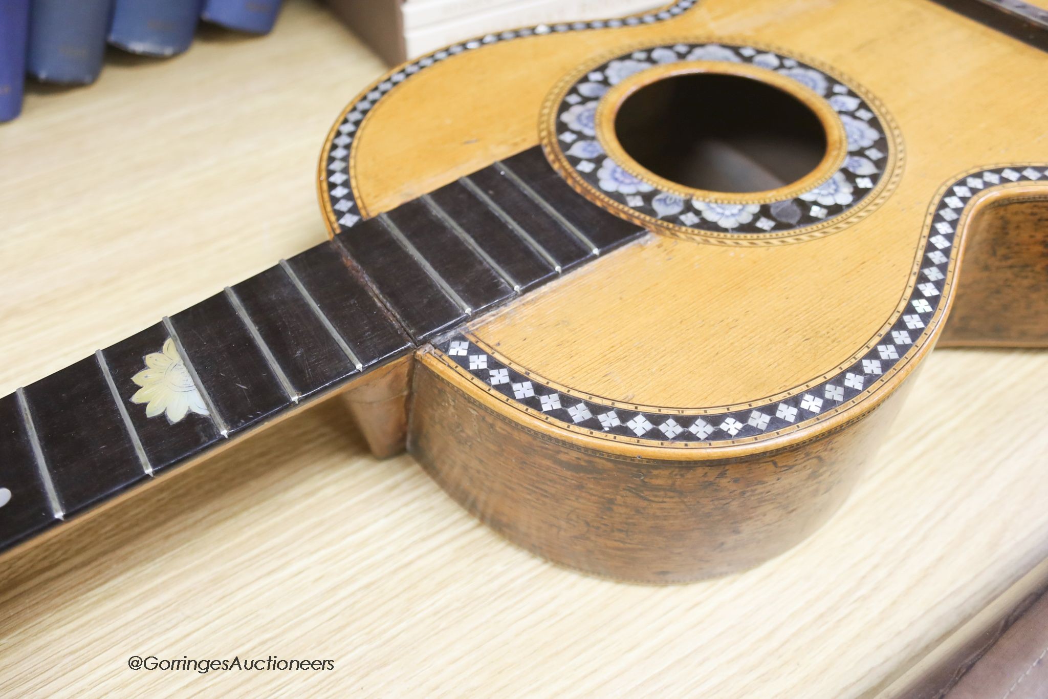 A Mexican mother of pearl inlaid acoustic guitar (no strings)